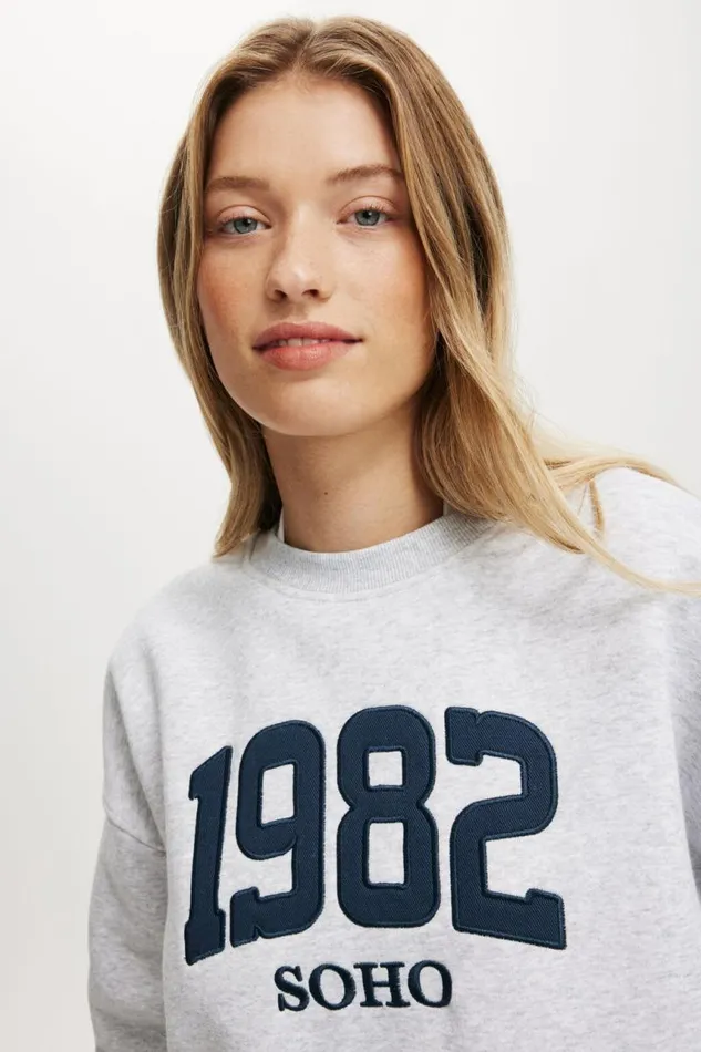 Cotton On SweatsandHoodies Classic Fleece Graphic Crew Sweatshirt 1982 Soho Soft Grey Marle 8211 Women Cotton On SweatsandHoodies Classic Fleece Graphic Crew Sweatshirt 1982 Soho Soft Grey Marle 8211 Women