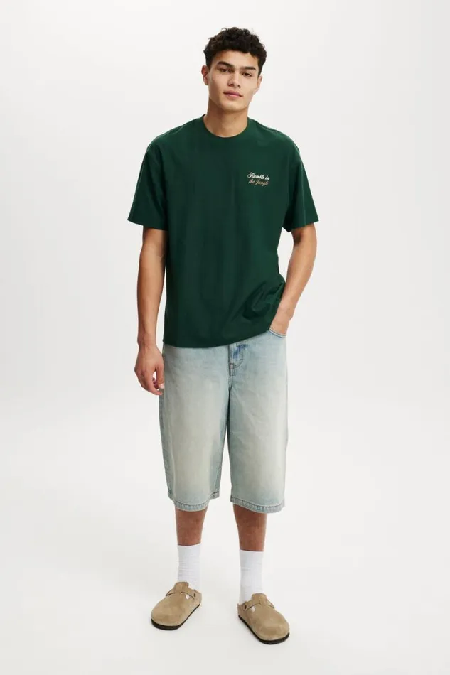 Cotton On Tees and Tanks Ali Loose Fit TShirt Lcn Ali Pineneedle Greenali 8211 Rumble In The 8211 Men Cotton On Tees and Tanks Ali Loose Fit TShirt Lcn Ali Pineneedle Greenali 8211 Rumble In The 8211 Men
