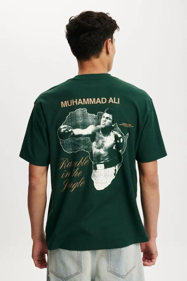 Cotton On Tees and Tanks Ali Loose Fit TShirt Lcn Ali Pineneedle Greenali 8211 Rumble In The 8211 Men Cotton On Tees and Tanks Ali Loose Fit TShirt Lcn Ali Pineneedle Greenali 8211 Rumble In The 8211 Men